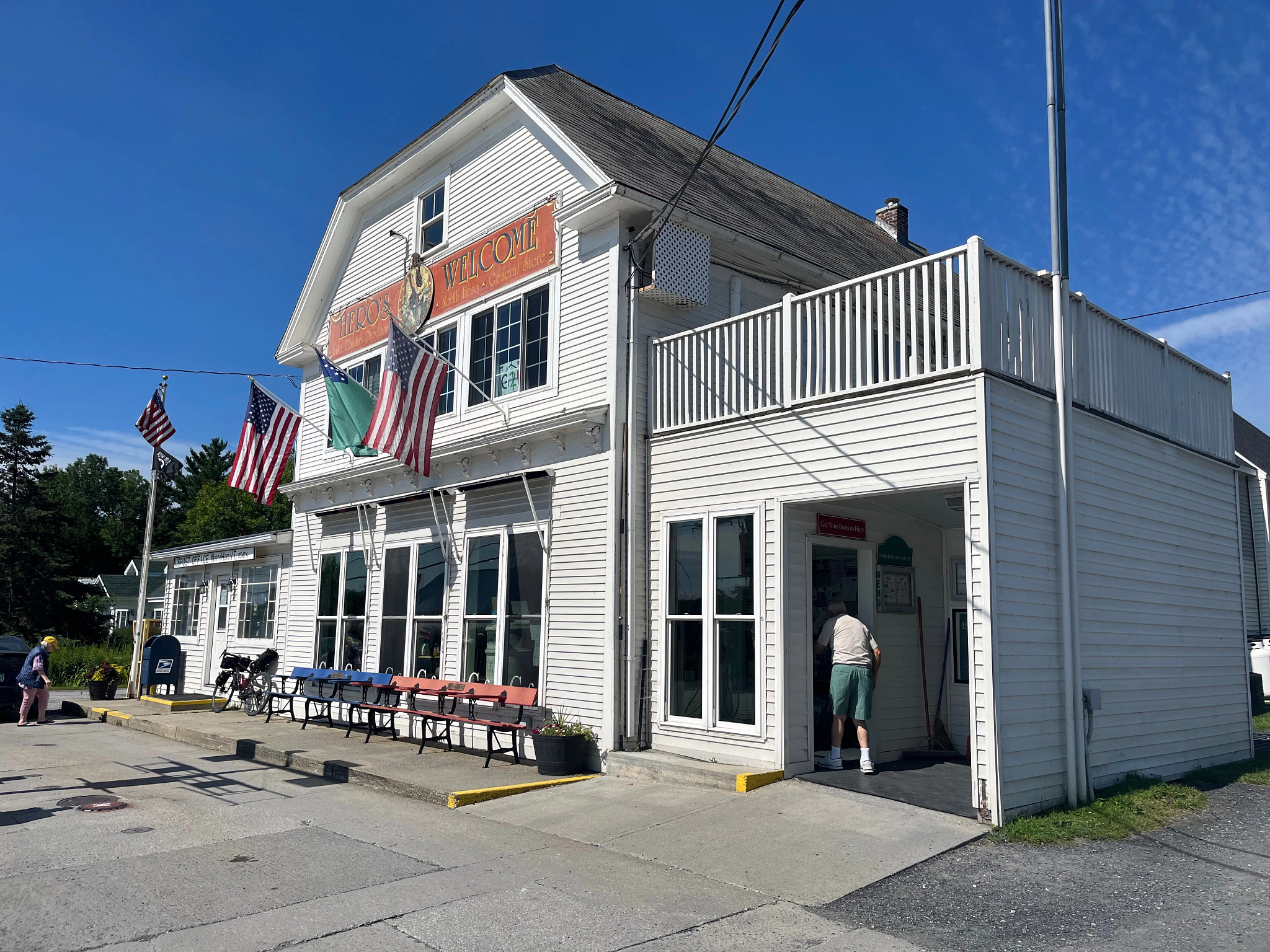 a pair of people walking into a store
