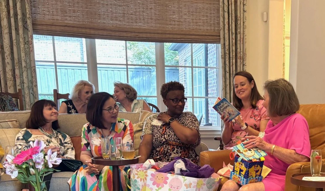 a photo shows Cheryl Hall, her daughter Katelyn Munoz and Hall's friends at her grandmother shower
