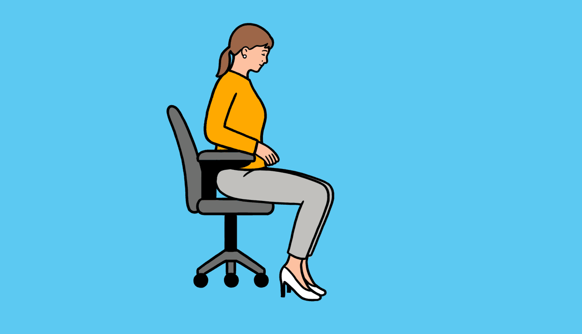 A woman sits forward in a desk chair and kicks one leg out.