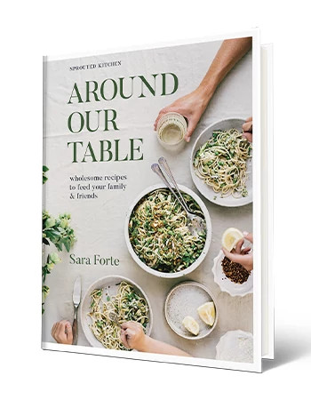 Cookbook that says Around Our Table Wholesome Recipes to Feed Your Family and Friends, Sara Forte; big dish of spaghetti and two plates of spaghetti on cover