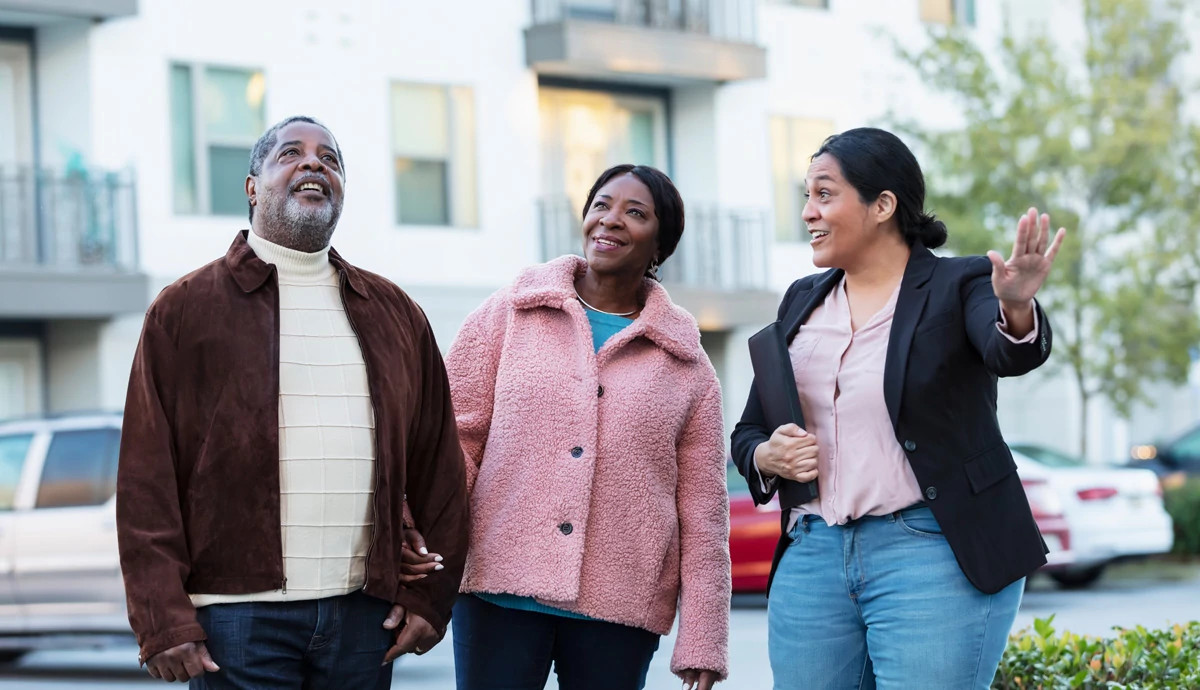 three people smiling