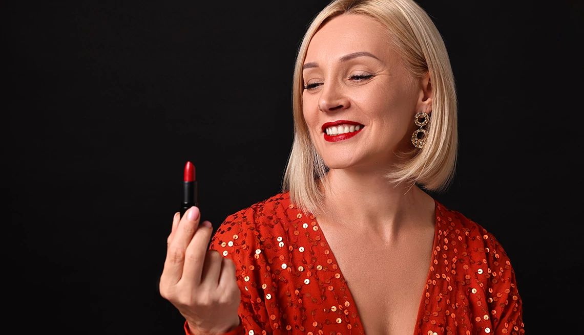 Find the best red lipstick smiling woman with red lipstick on black background
