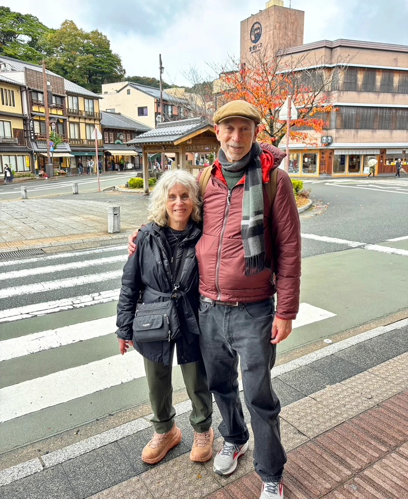 a photo shows Zack Rogow traveling with his partner