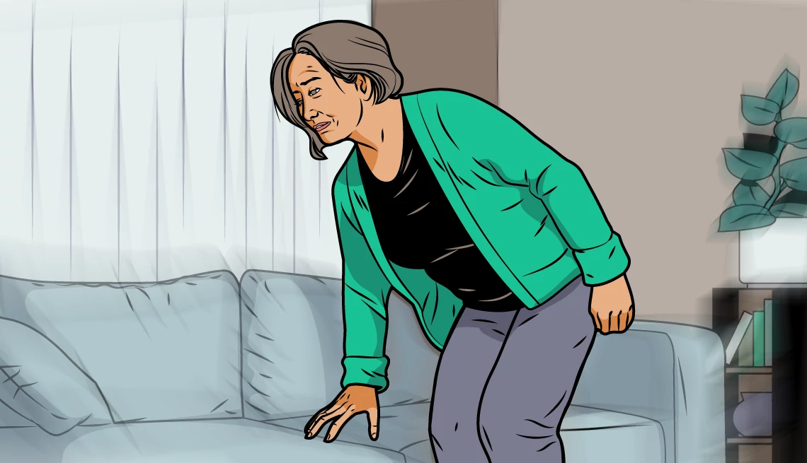a woman appears to be stumbling while reaching for a couch