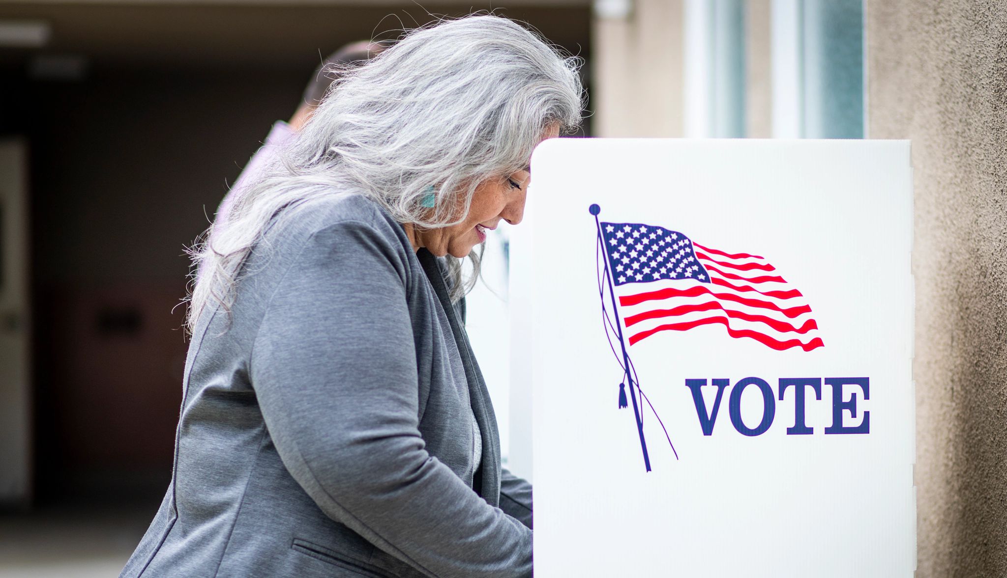 Older voters impact 2024 election A senior woman at the voting booth