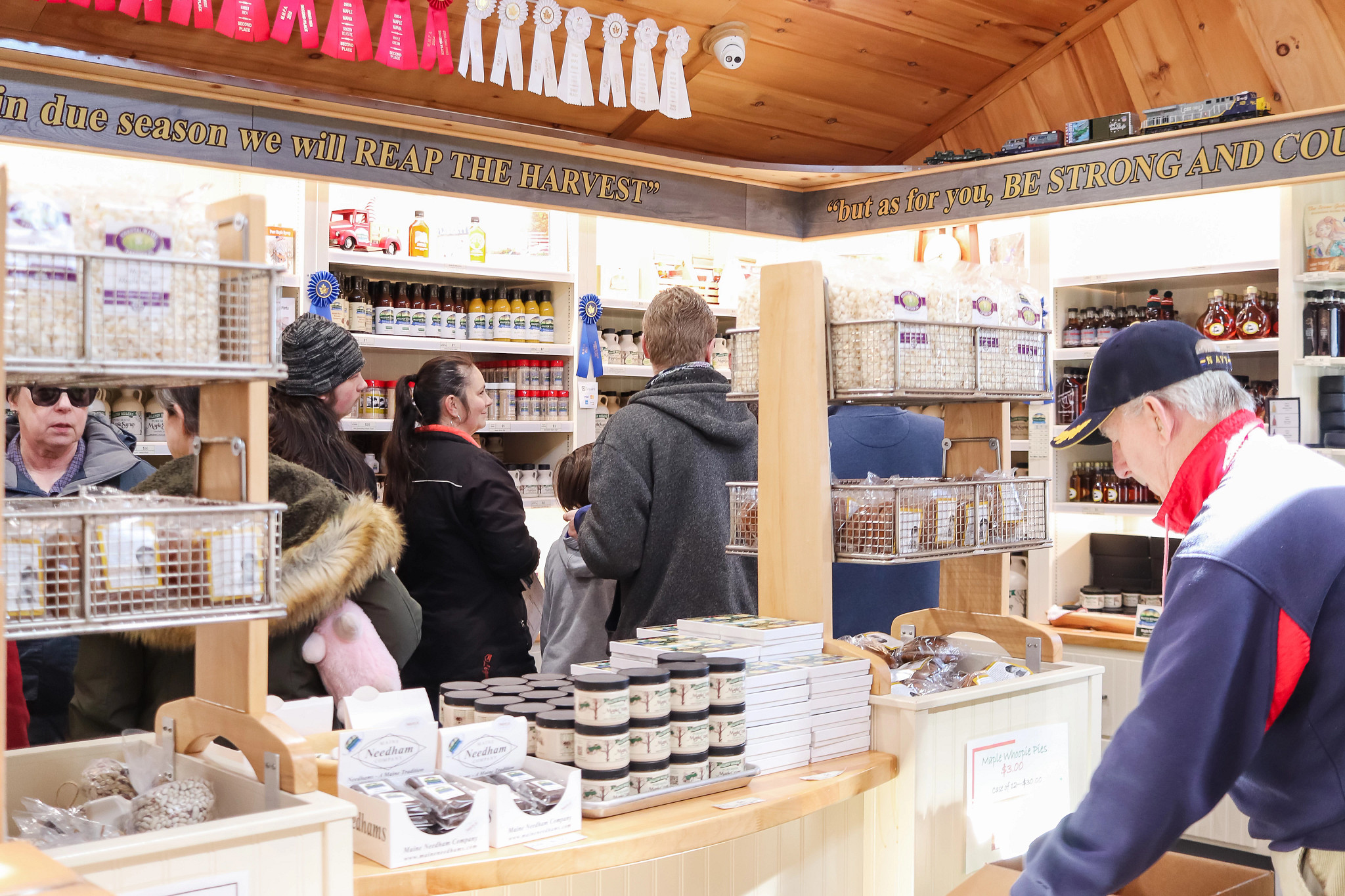 people inside a store at a maple farm