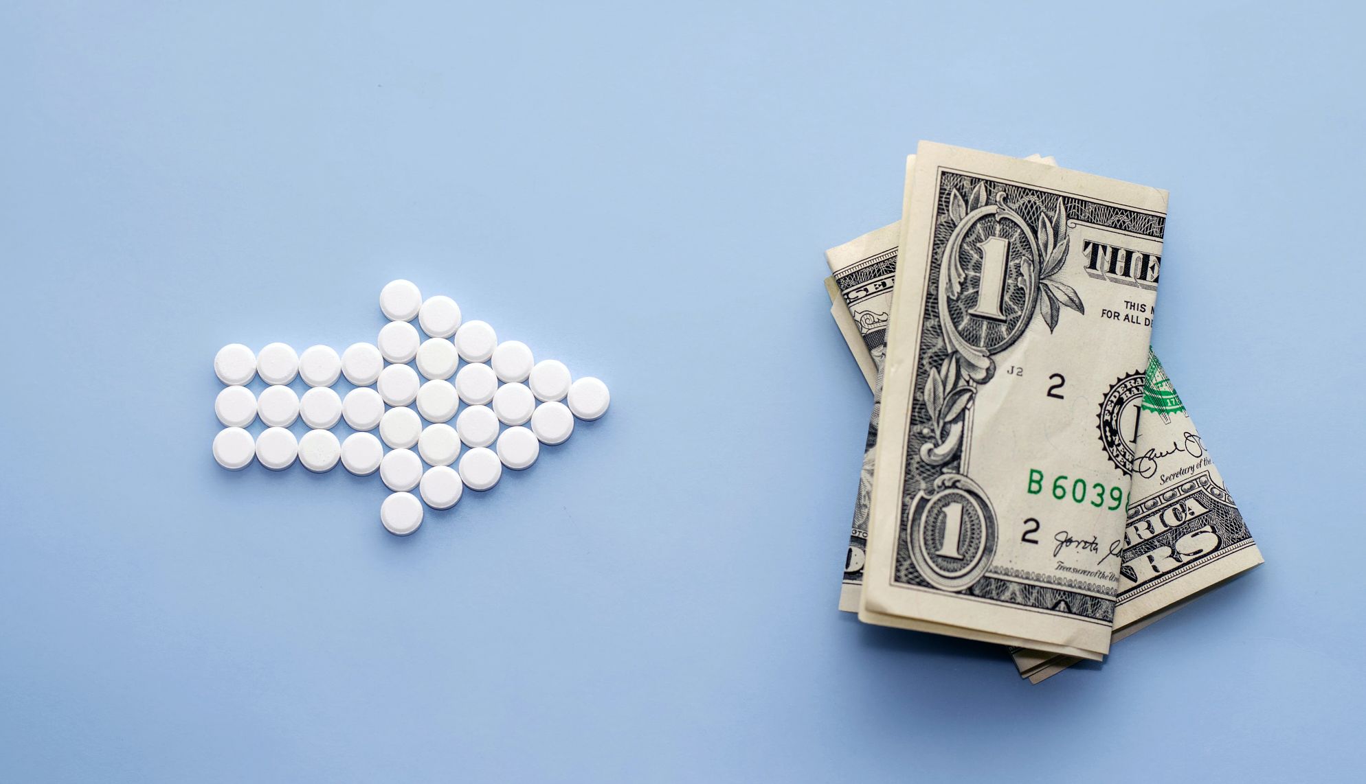 Prescription Drug Cap an arrow pointing to a dollar bill
