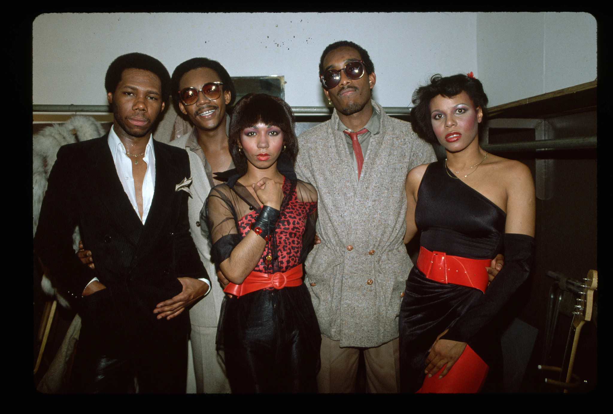 The musical group Chic posing together.