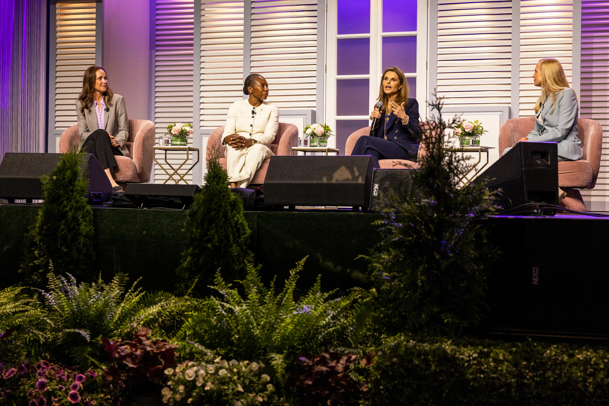 Dr. Myechia Minter-Jordan, Maria Shriver and Dr. Beri Ridgeway speaking on stage during a panel discussion