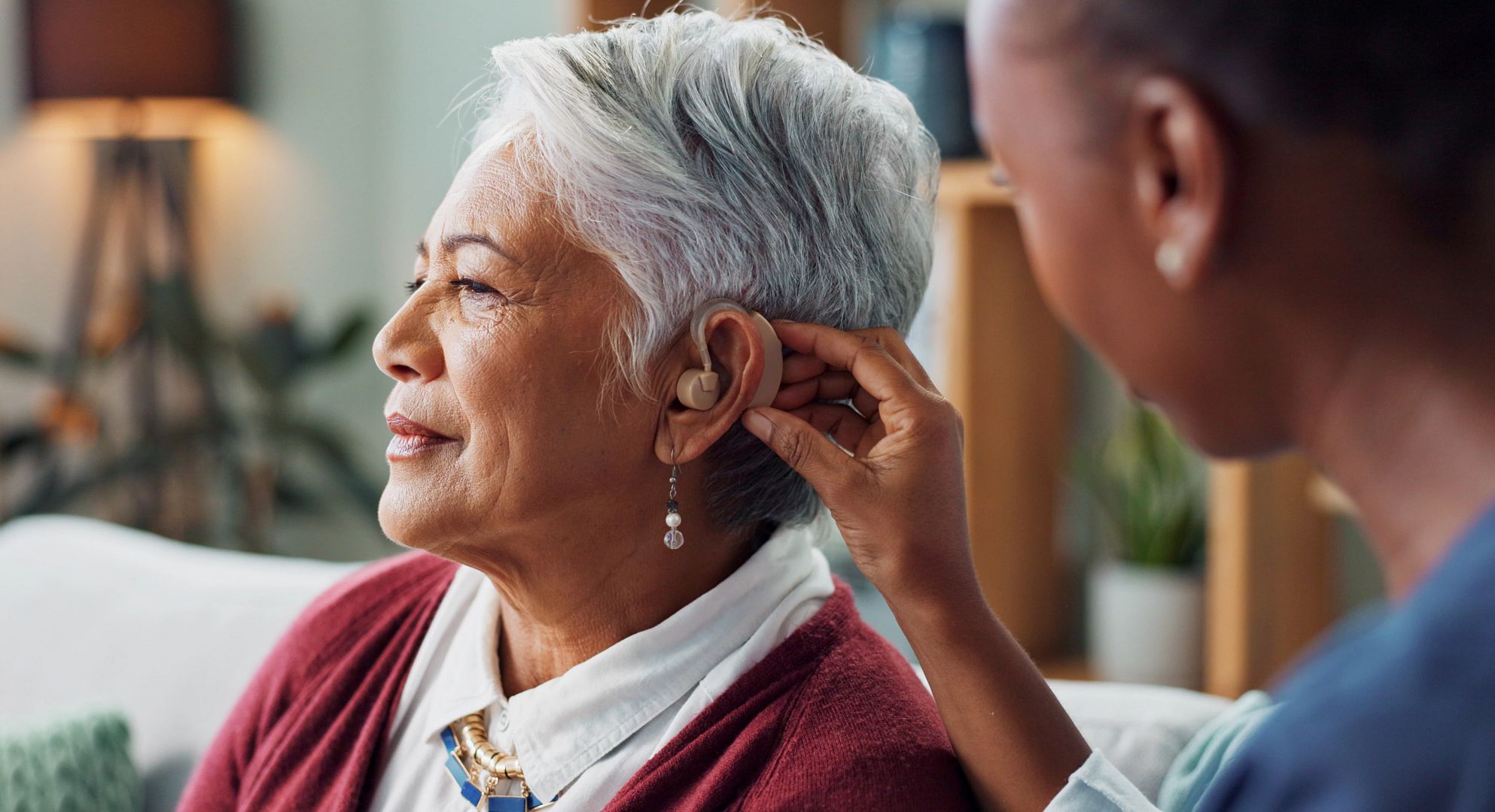 Woman with hearing aid Woman with hearing aid