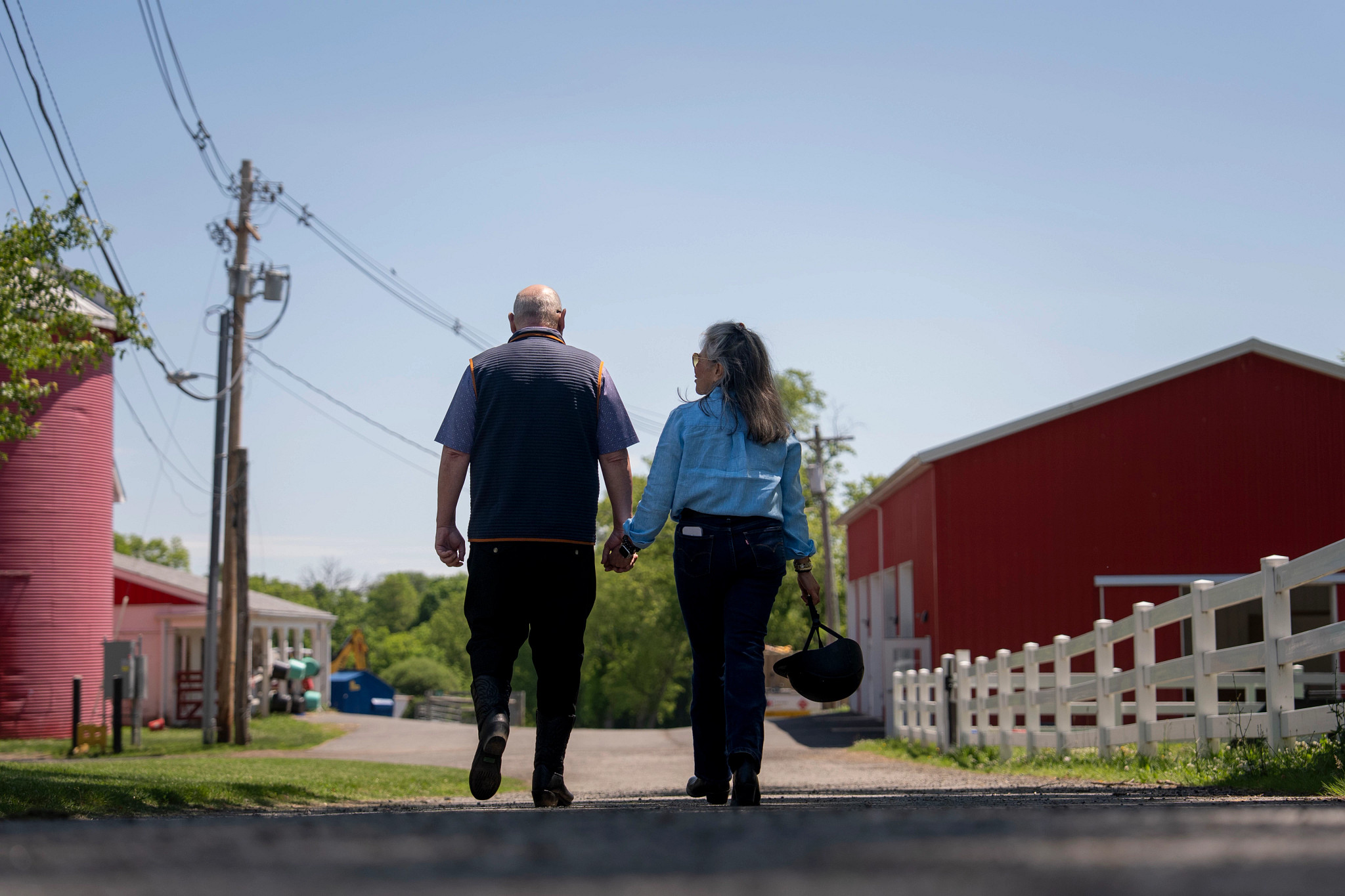 people walking while holding hands