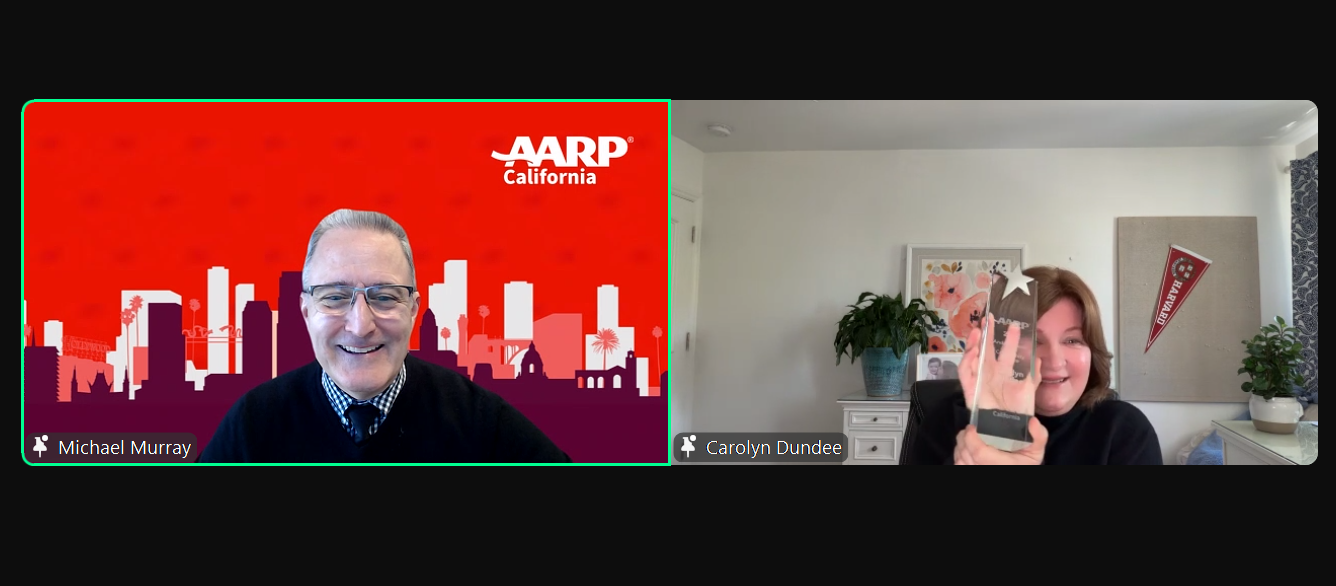 carolyn dundee smiling with her award