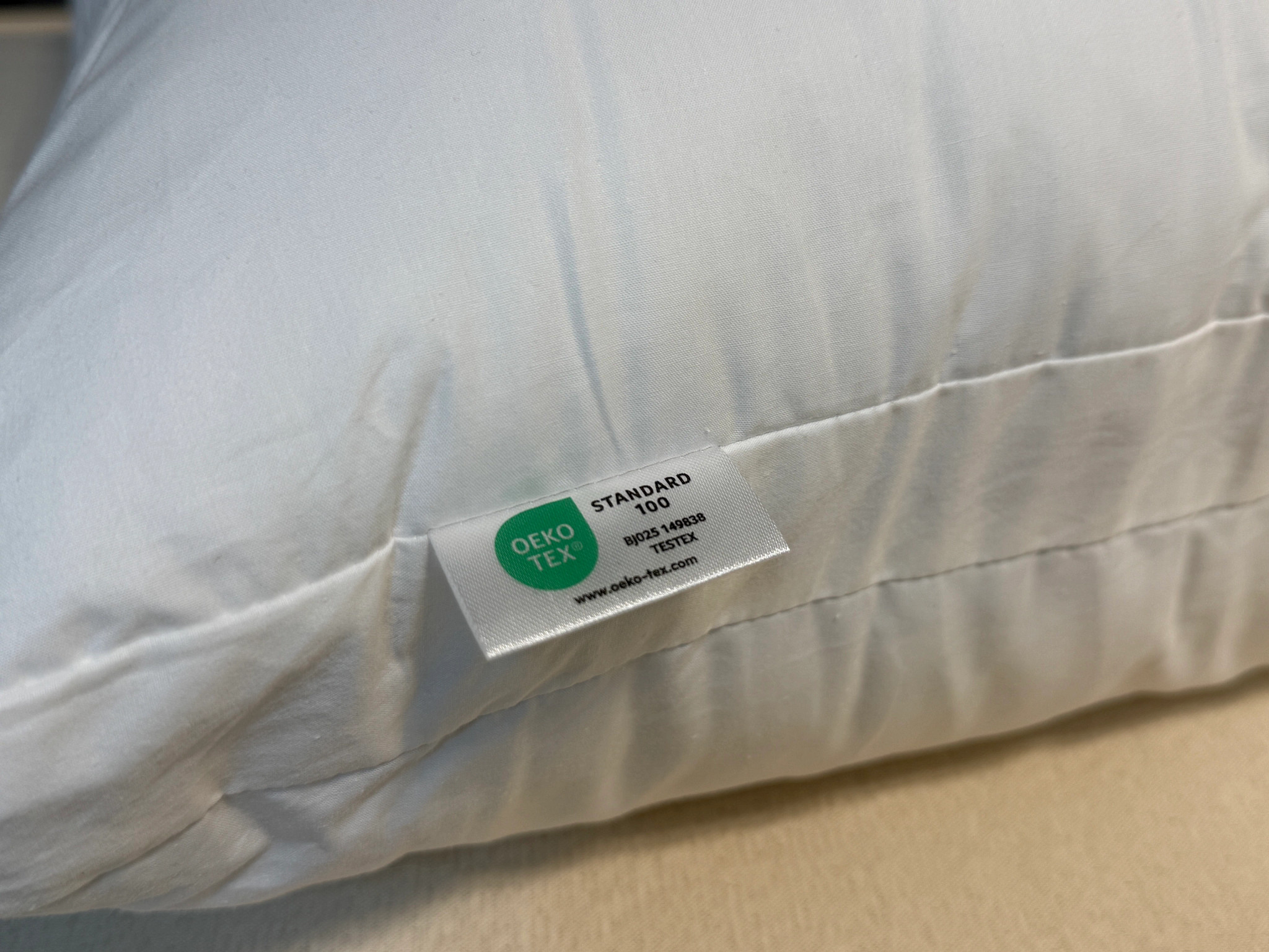  A close-up of the certification tag on the Silk and Snow Adjustable Pillow