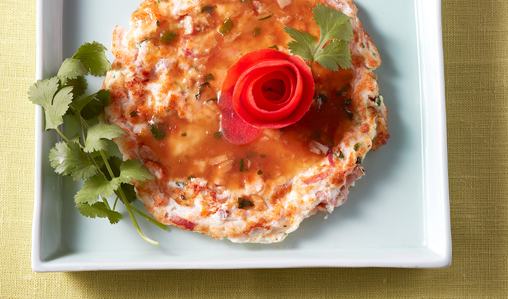 A close-up view of salmon foo yung on a plate