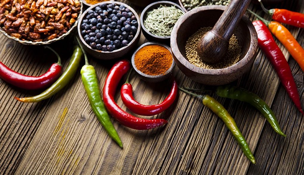 Spice up your meals as an alternative to sodium A close-up view of spices and herbs in bowls on dark wood
