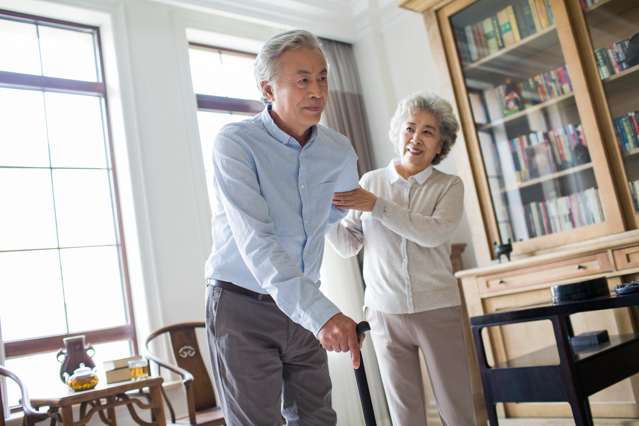 Senior woman taking care of husband