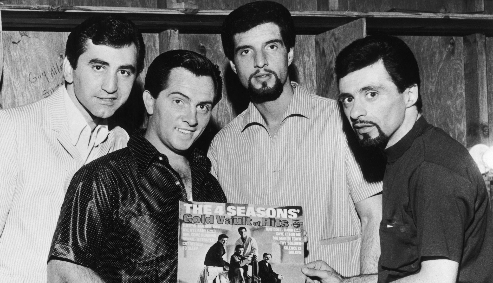 Frankie Valli, Joe Long, Tommy DeVito and Bob Gaudio were in The Four Seasons Young Frankie Valli with Joe Long, Tommy DeVito and Bob Gaudio holding The 4 Seasons Gold Vault of Hits album