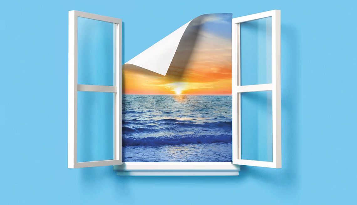 Reflecting on Life and Finances After a Cancer Diagnosis A vibrant sunset spills onto the sea, captured within a window frame