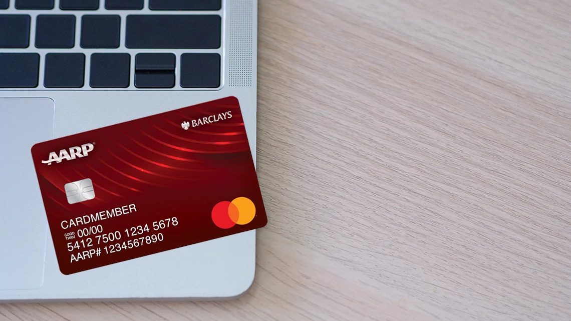 AARP Essential Rewards Mastercard from Barclays Red Credit Card on Laptop