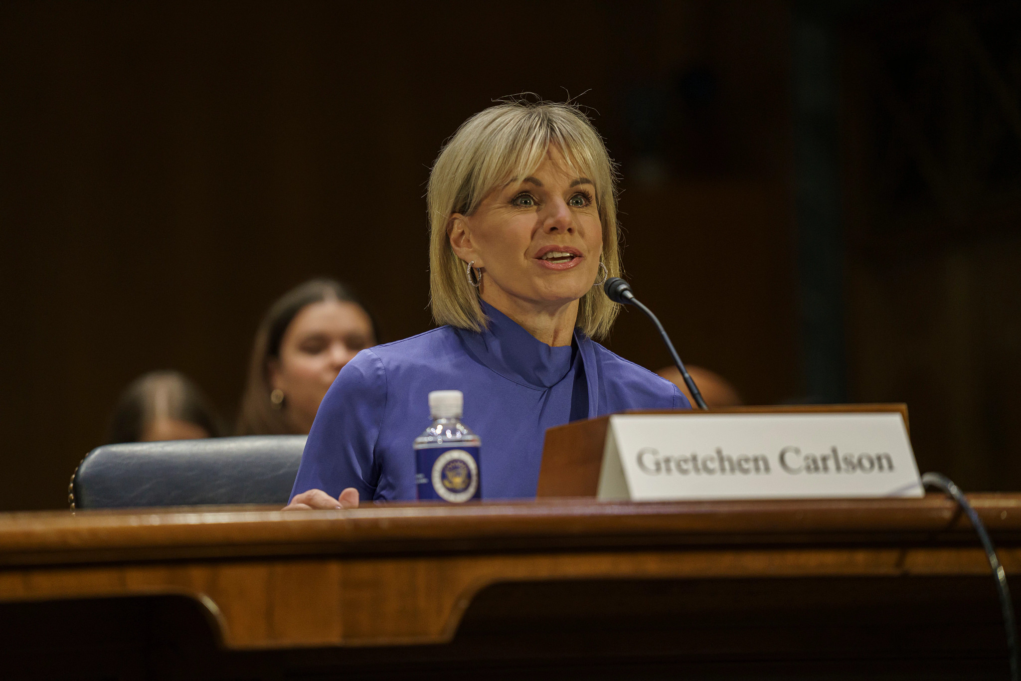 a person speaking at a hearing