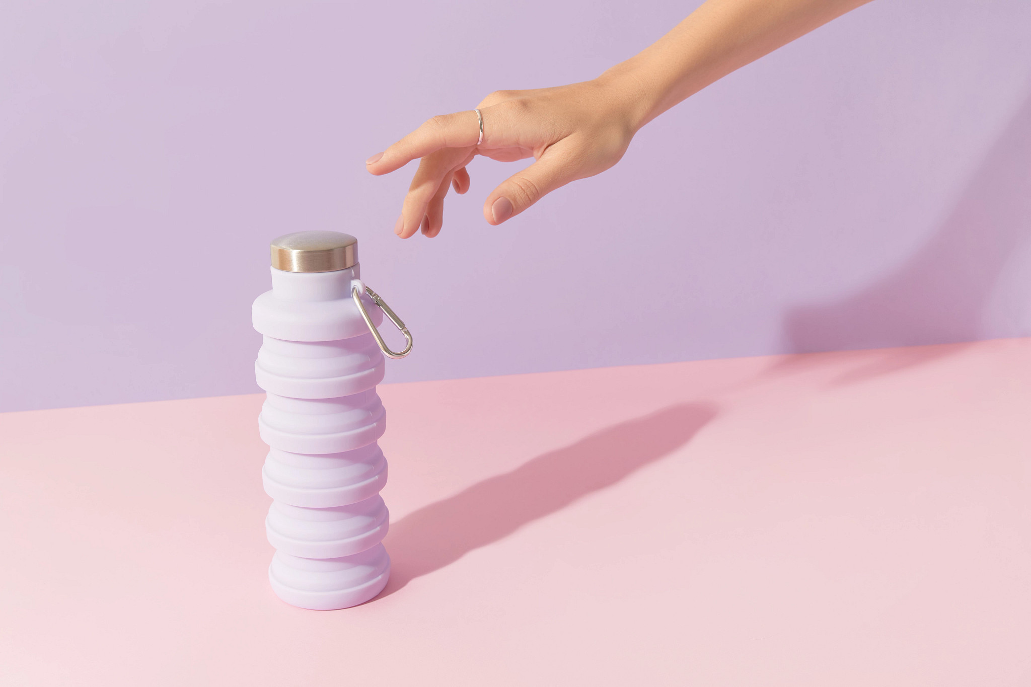 hand reaching for water bottle