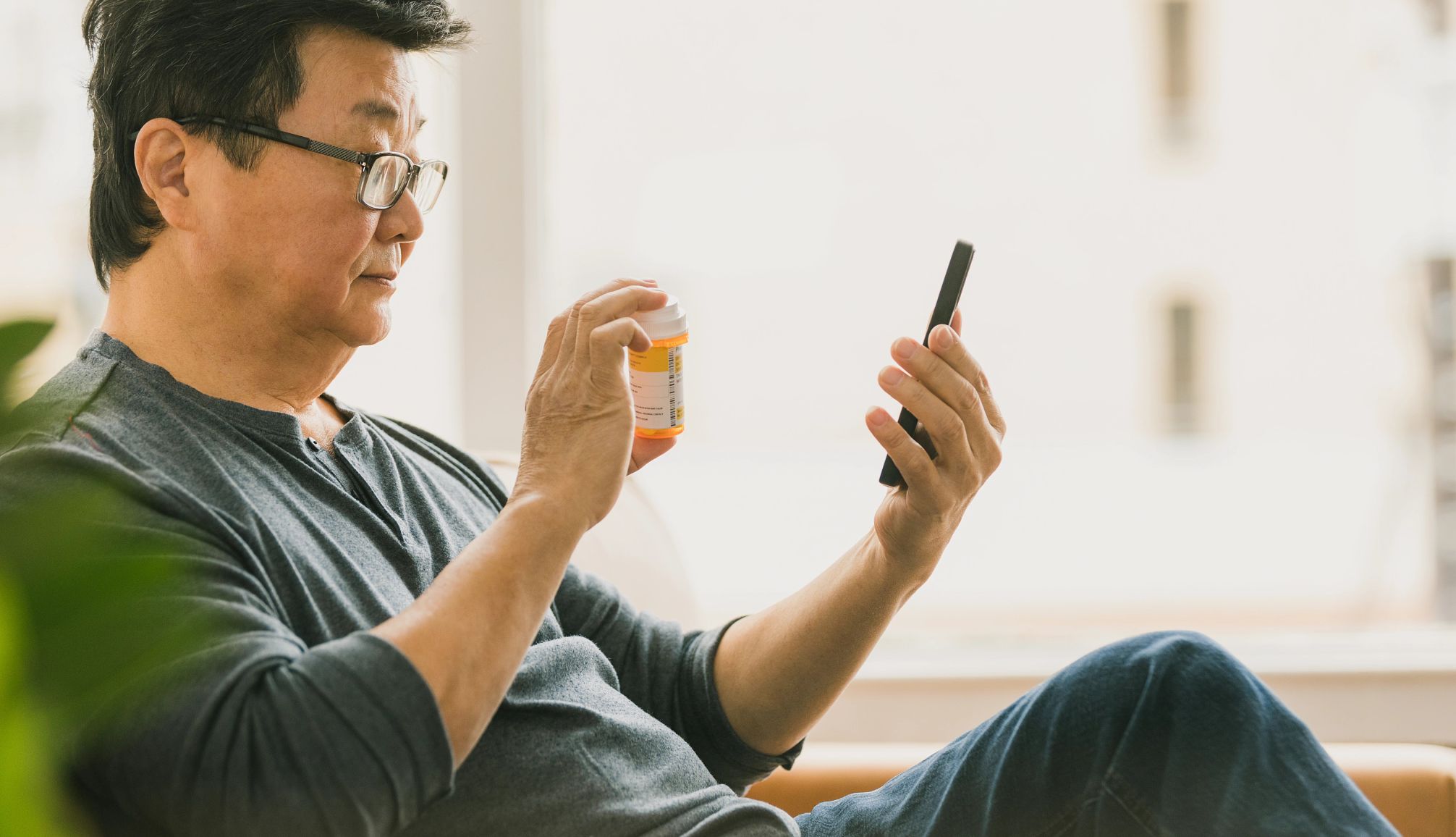 Can Technology Help You Care for Loved Ones? a man looking at his phone