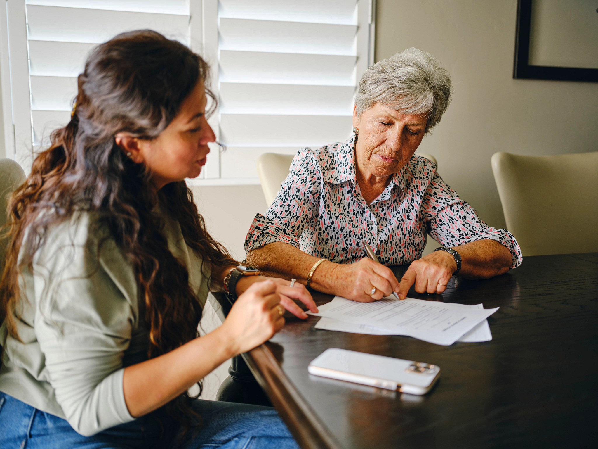two people filling out paper work