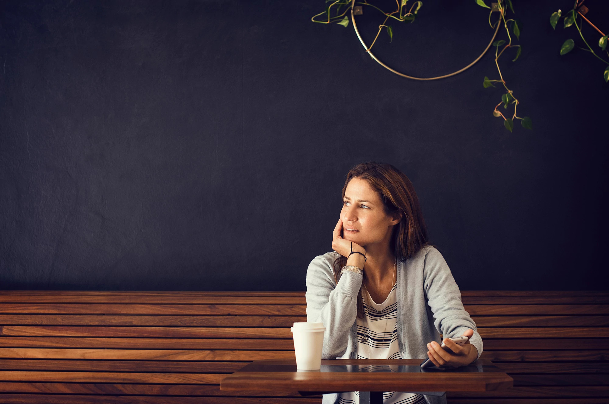 woman sitting alone at coffee shop