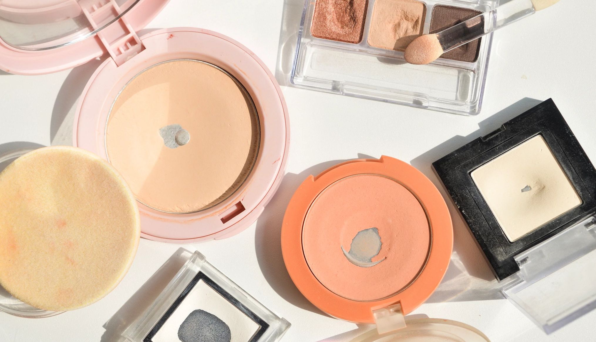 Refresh Your Wardrobe and Beauty Products makeup compacts opened to show used products in poor condition