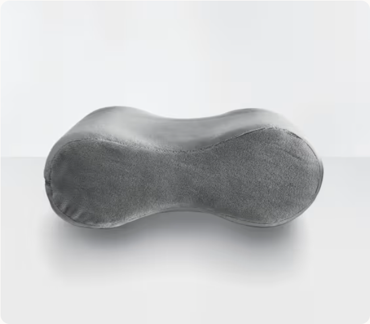 A gray Sleep Number Knee Pillow displayed on a white background