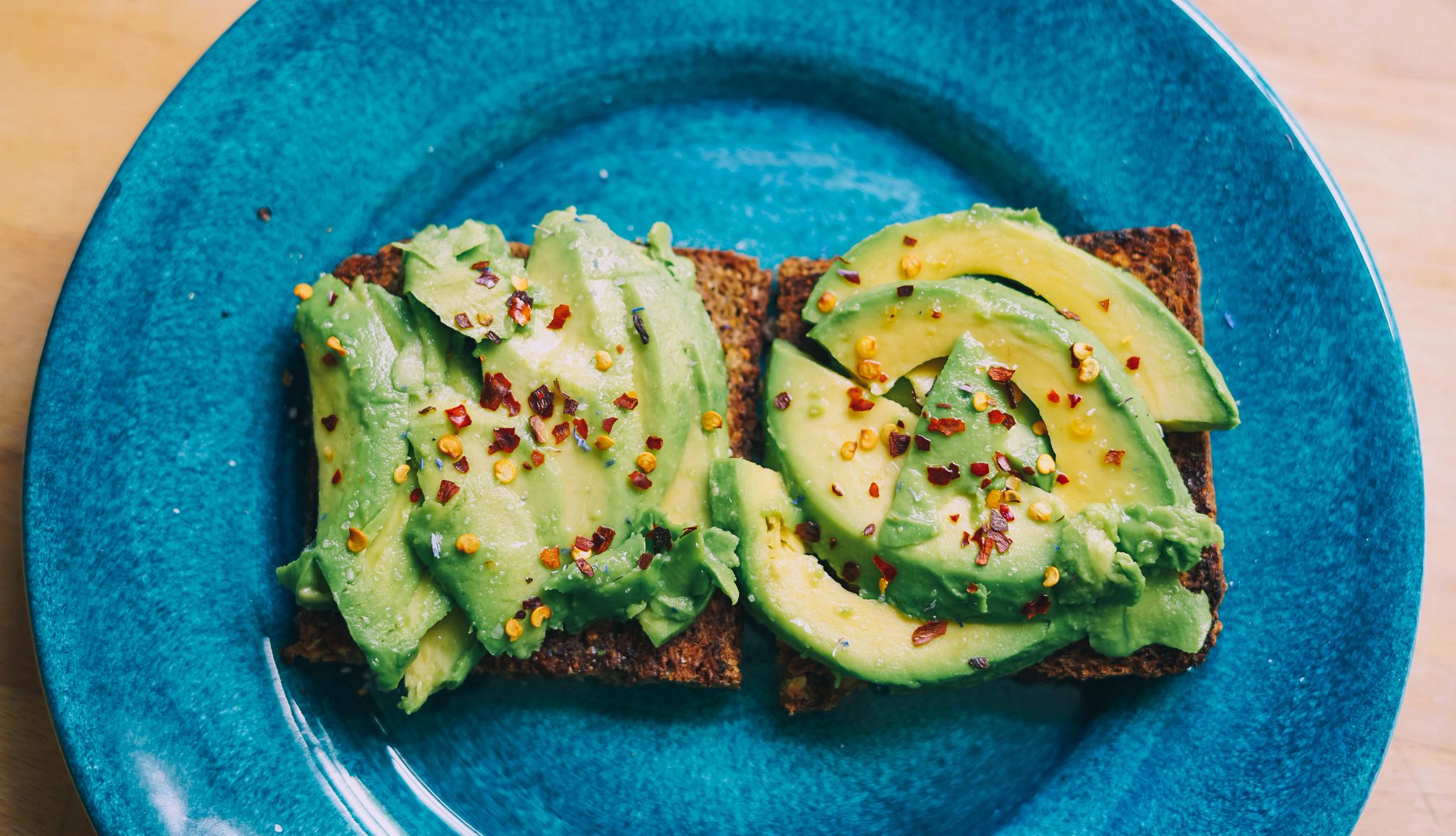 A photo shows sliced avocado on toast