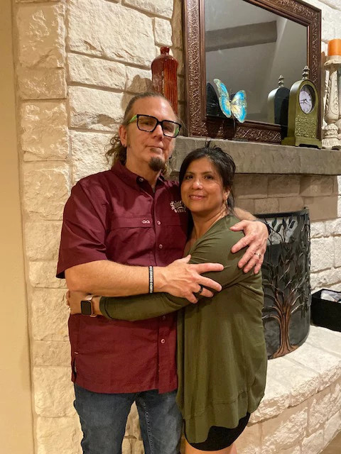 A photo shows married heavy metal lovers Joseph and Reyna Tharp