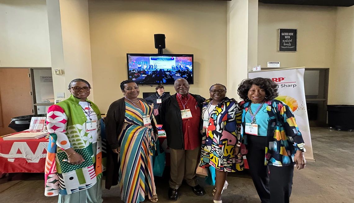 AARP Staying Sharp had a booth at the Alter Dementia Summit A group of Alter Dementia Summit attendees pose in front of the AARP booth