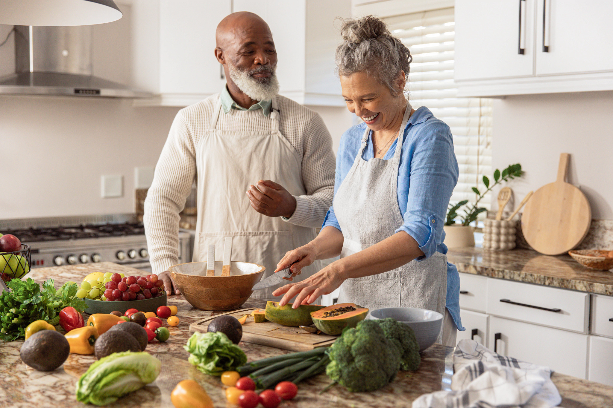 mature couple preparing food