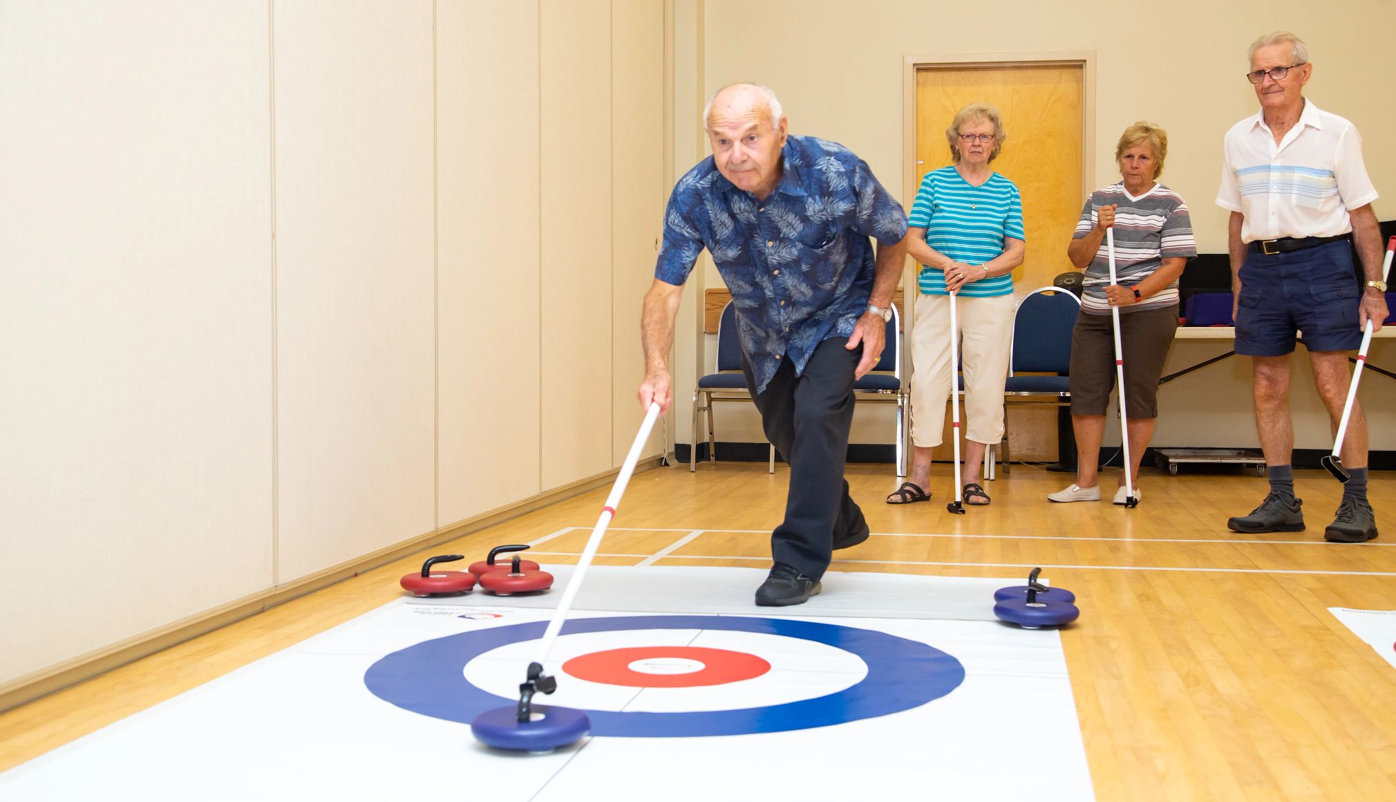 Find Your New Favorite Hybrid Sport a person is curling