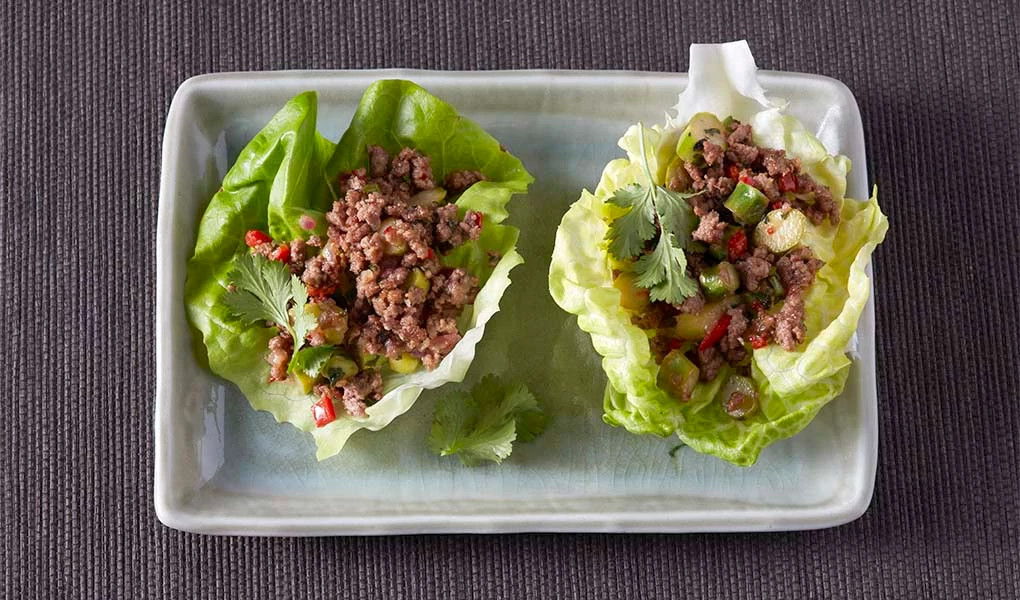 A close-up view of Thai-style lettuce cups on a plate