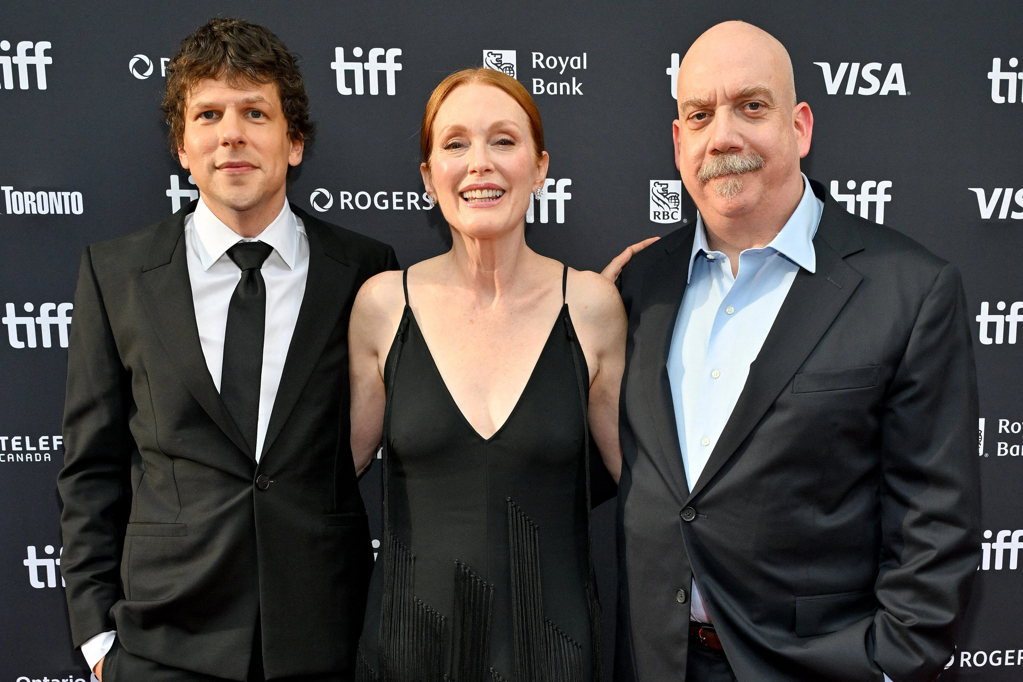 Jesse Eisenberg, Julianne Moore and Paul Giamatti posing together at Toronto International Film Festival