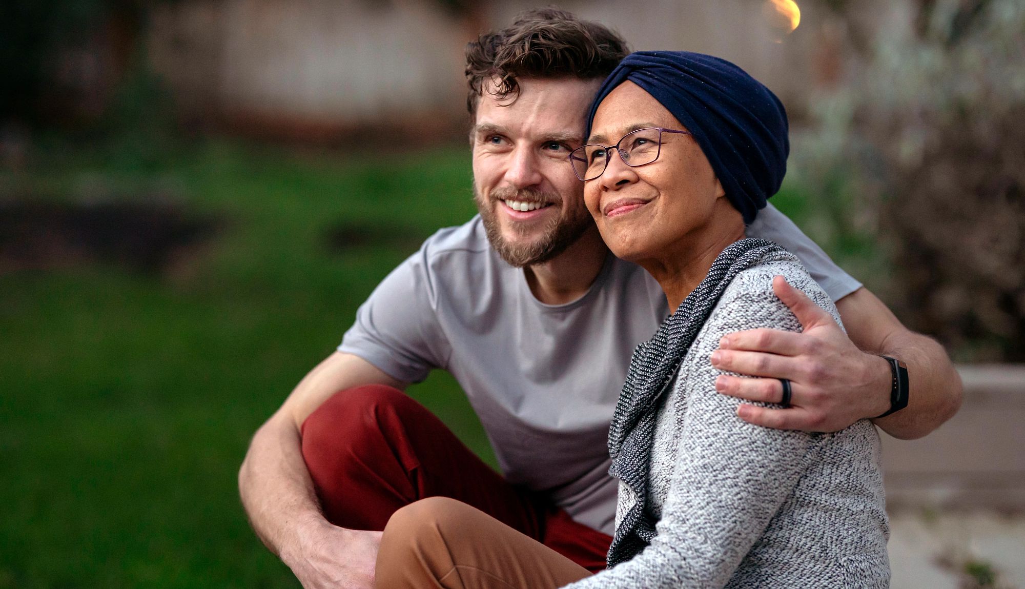 Voters want caregiver tax credit two adults embrace each other