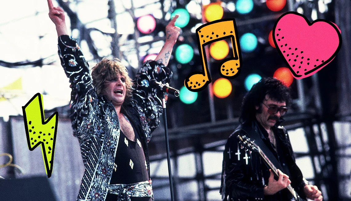 ozzy osbourne raising his arms during a performance