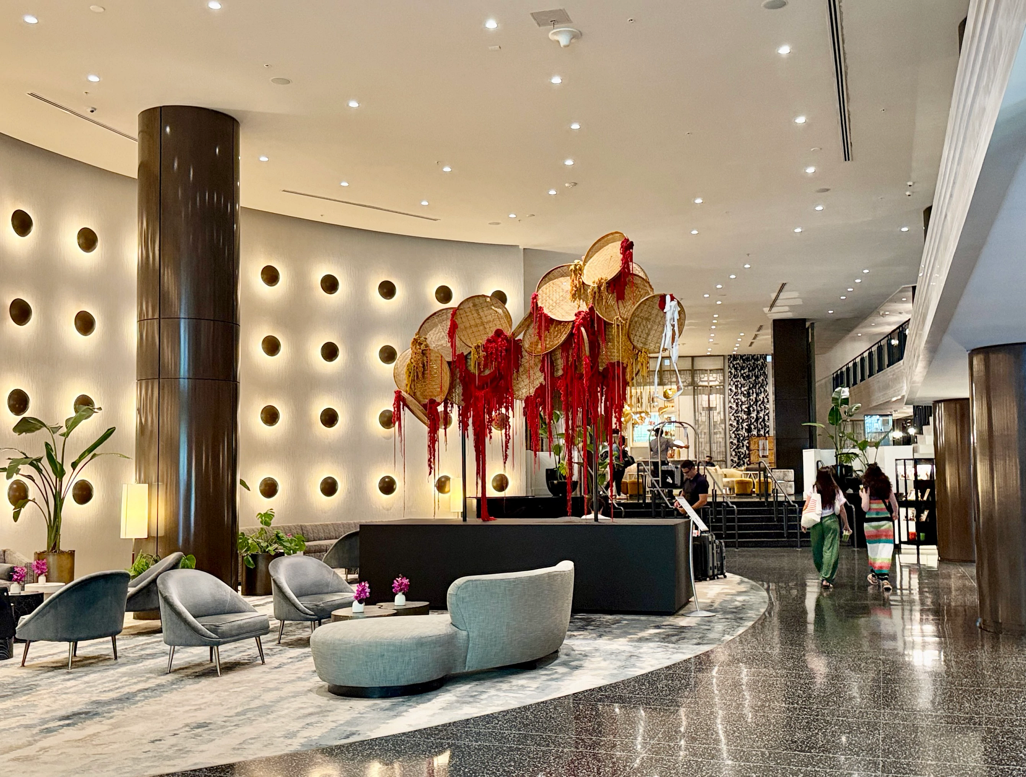 a hotel lobby with an art display