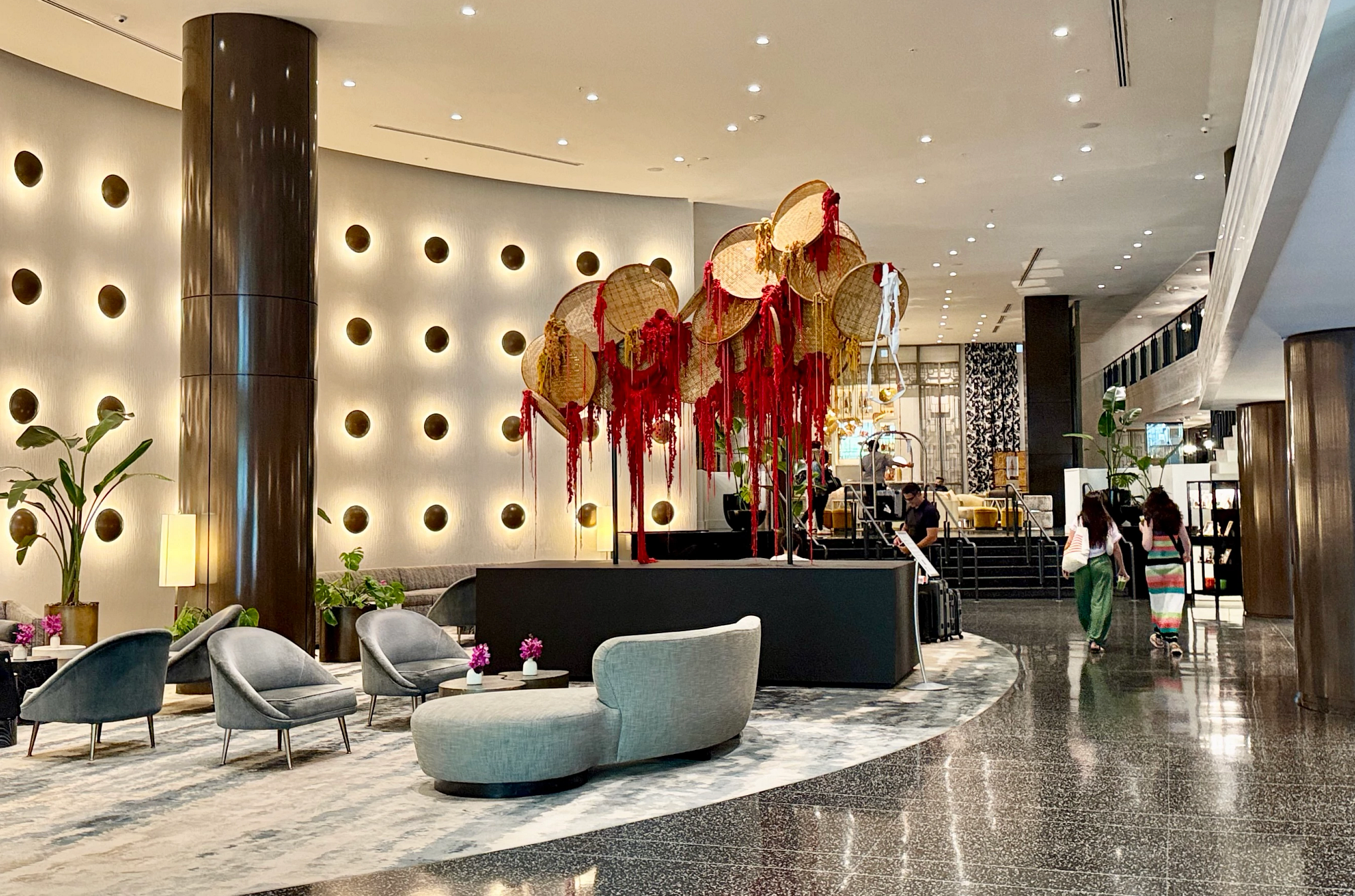 Ritz-Carlton a hotel lobby with an art display