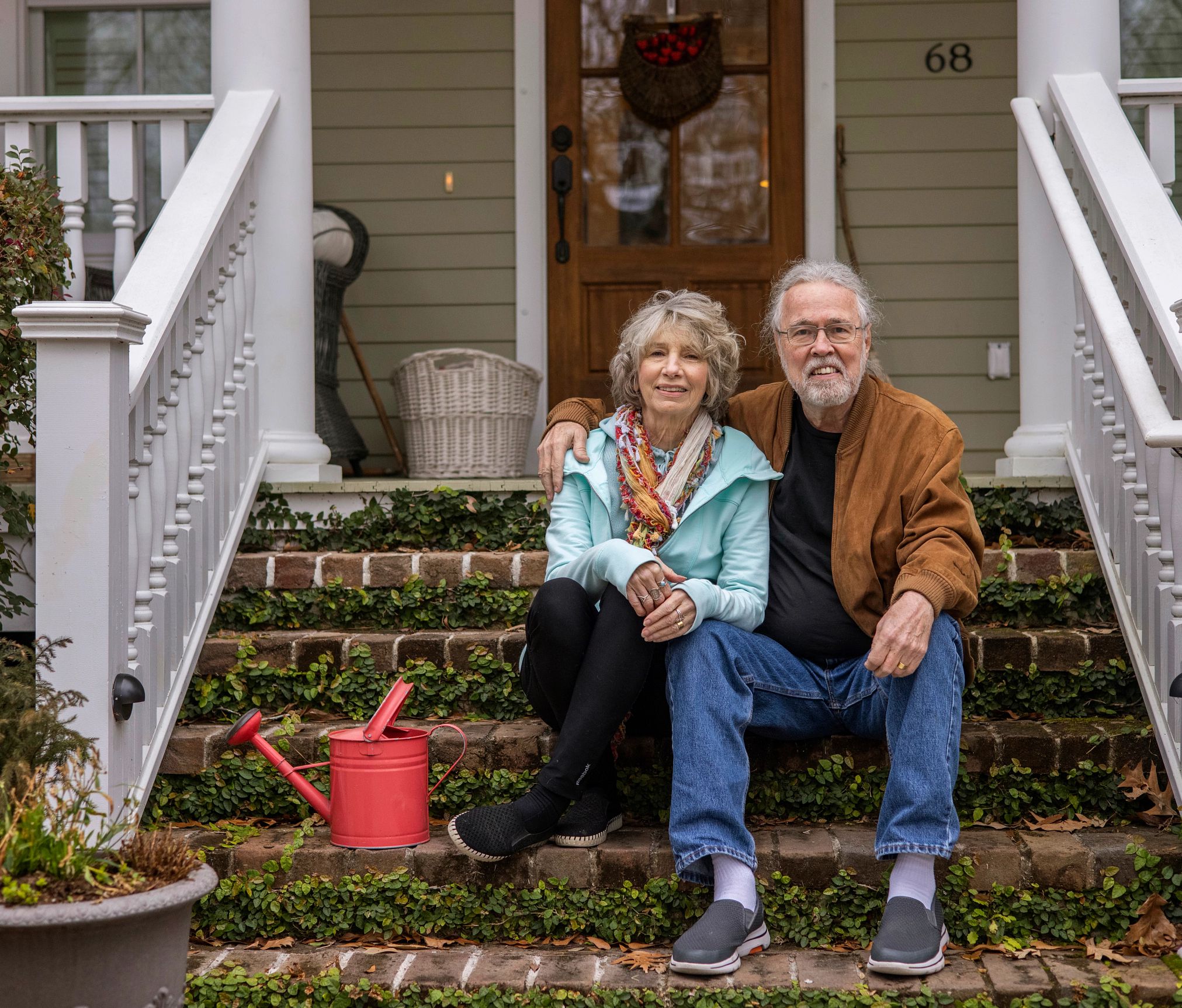 a couple sitting on their porch in beaufort, south carolina