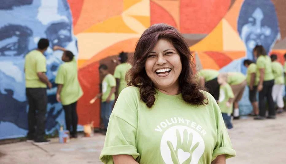lady wearing a green volunteer shirt