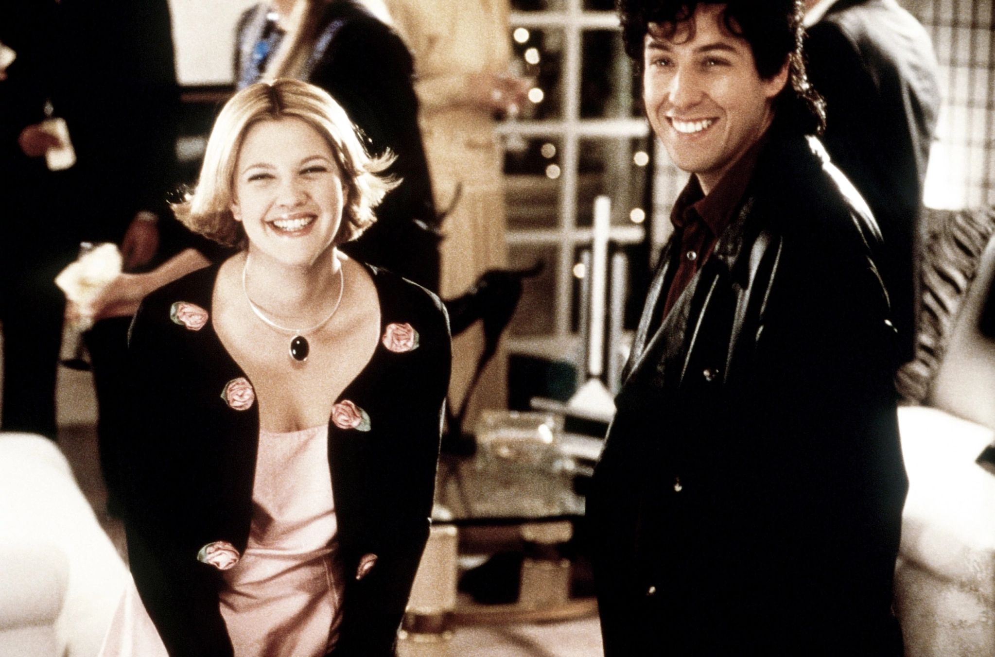 Drew Barrymore and Adam Sandler in The Wedding Singer iconic scene Drew Barrymore and Adam Sandler smiling together in a scene from the movie "The Wedding Singer"