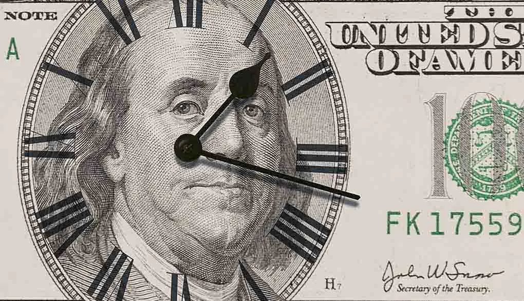 Research finds people value time over money as they age An up-close view of a $100 bill with a clock on it