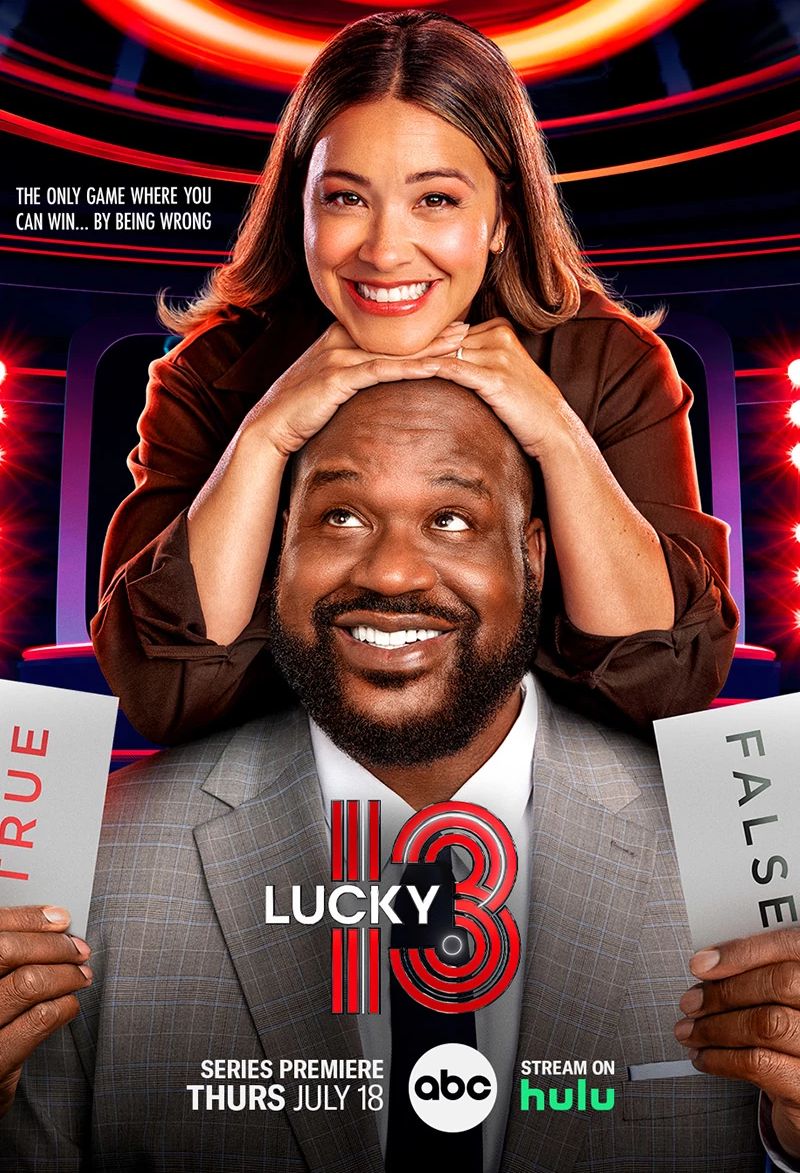 Shaquille O'Neal is co-hosting the new ABC game show, "Lucky 13," with actress Gina Rodriguez. promo for premier of ABC game show Lucky 13 on July 18 showing Gina Rodriguez with her hands and chin resting on Shaquille O'Neal's head, both of them are smiling