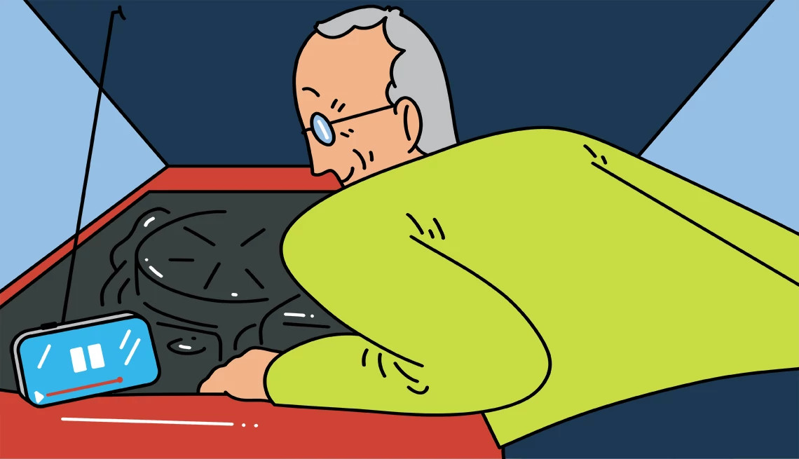 a person checking under the hood of a car