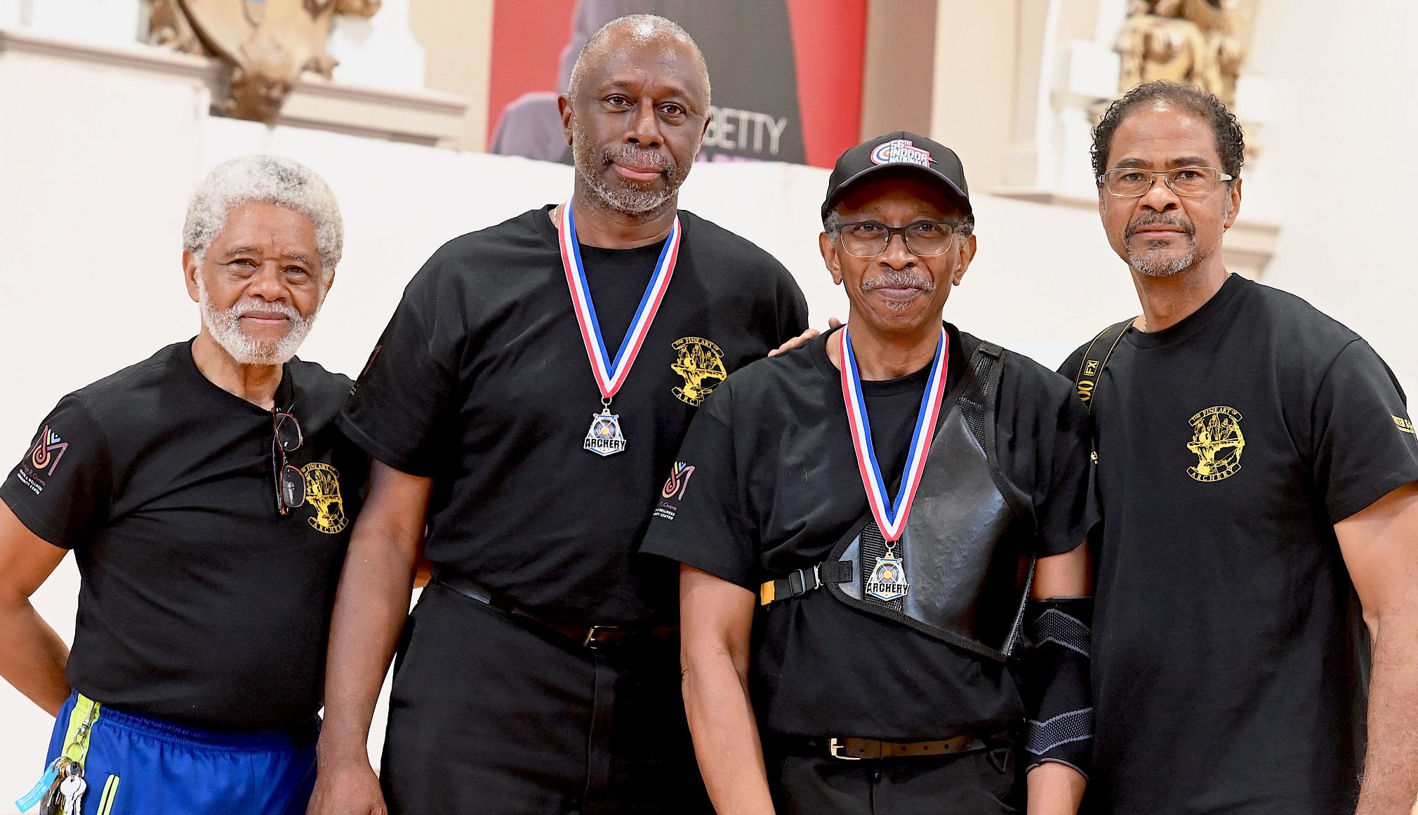 Archery can be a powerful tool for mental and physical well-being Center Shot Archers founder and coach Larry Brown, Anthony Keppel, coach William Griffith and coach Philip Jefferson at an April tournament