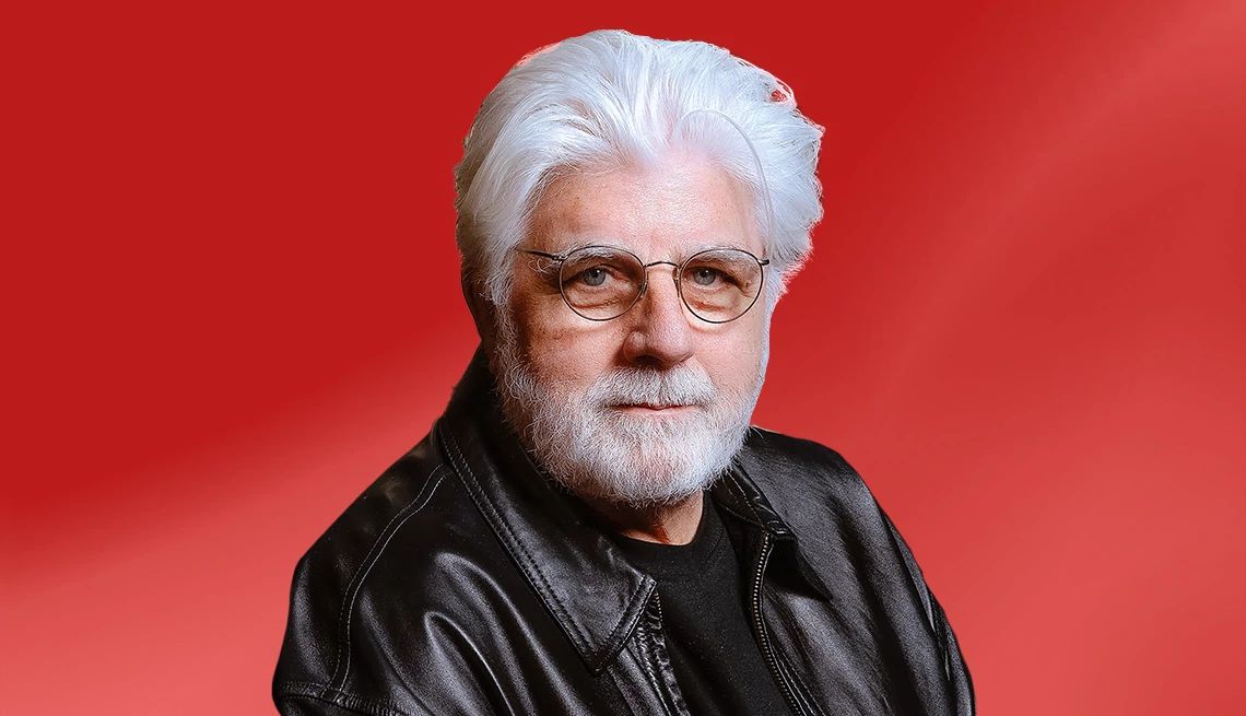 Michael McDonald against red ombre background