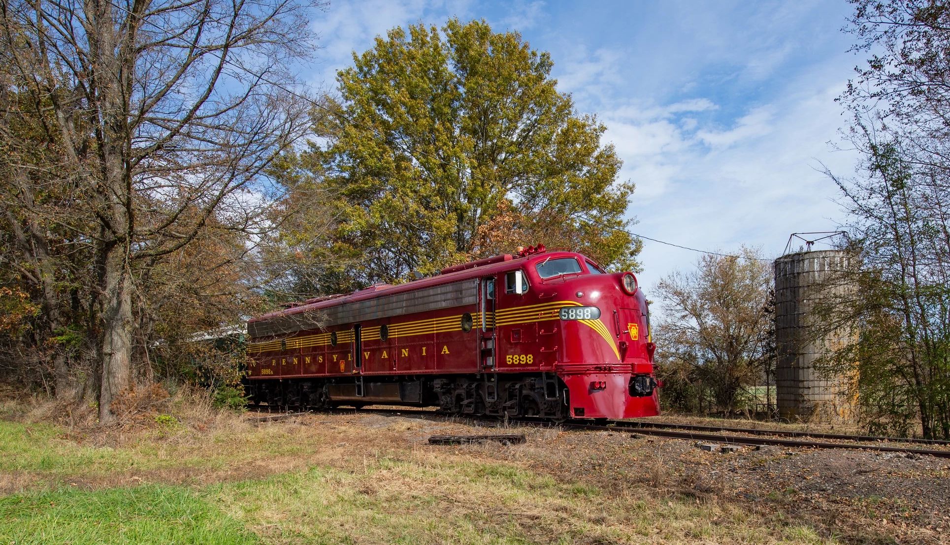 Spooky Train Rides a red train traveling on a railroad